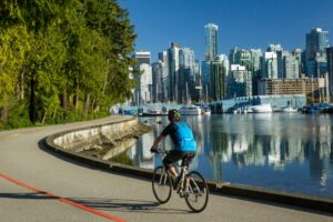 bike riding on the sea wall of downtown vancouver stanley park